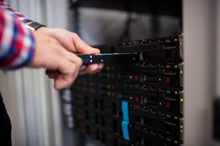 Technician Inserting Hard Disk Drive